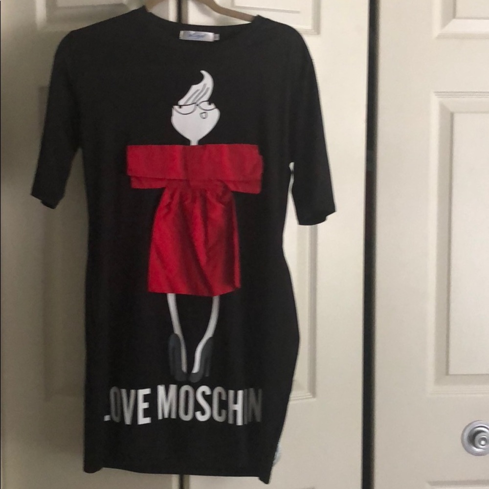 Black dress with a girl in a bow dress. ( box B)